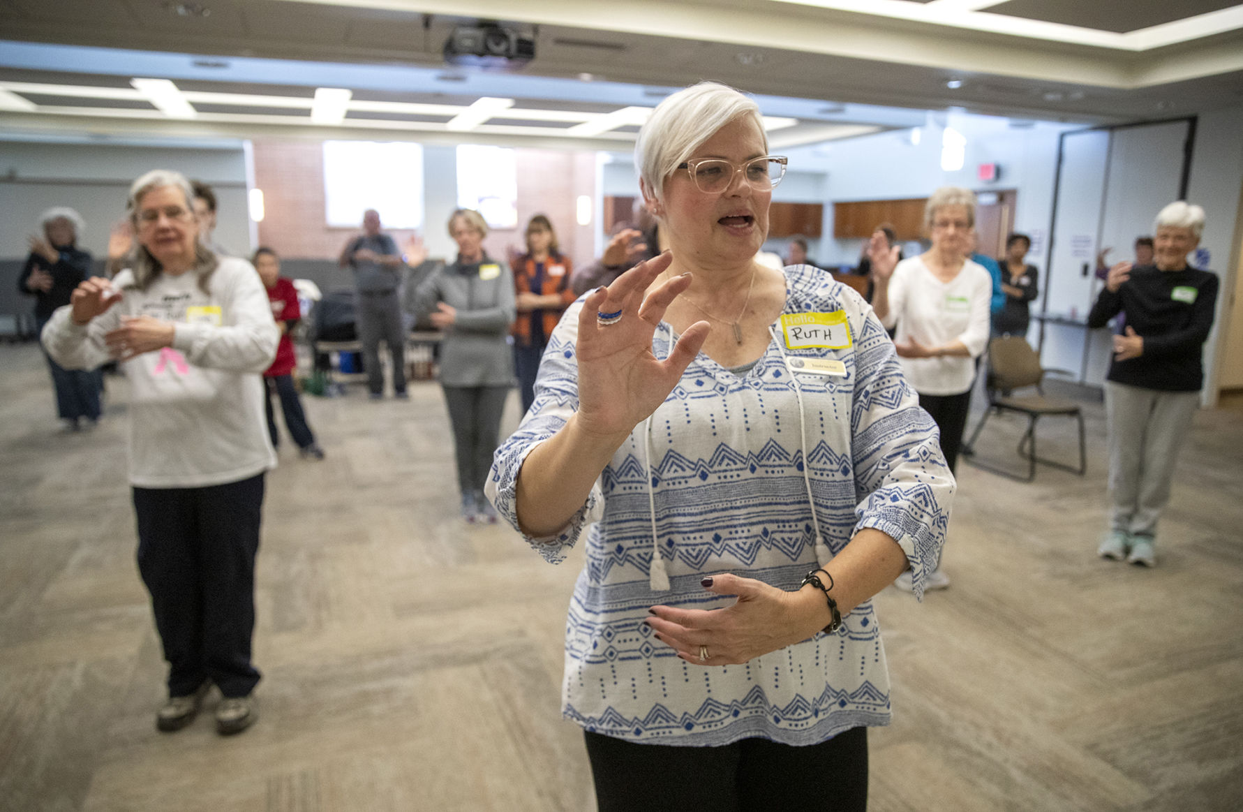 Certified Tai Chi for Rehabilitation instructor and area occupational therapist Ruth Devereuax leads a Tai Chi class at the Council Bluffs Public Library